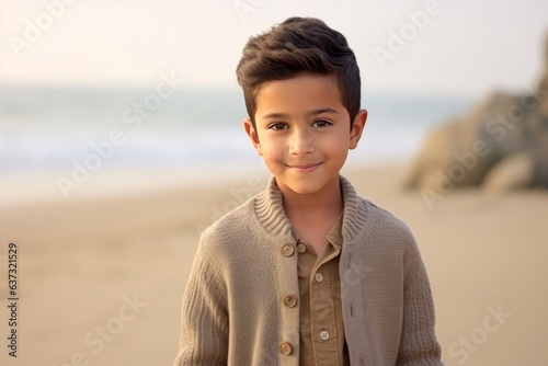 Medium shot portrait of an Indian child male in a beach 