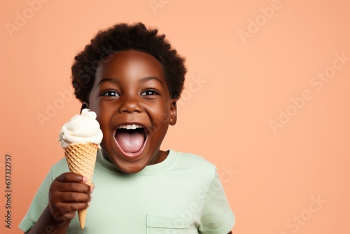 Surprise African Boy Holds And Eats Ice Cream On Pastel Background