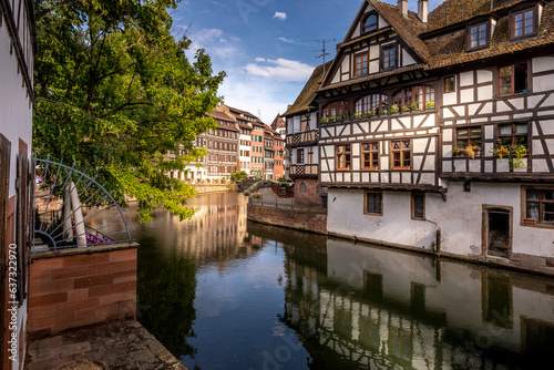 Strasbourg, France - June 19, 2023: Traditional half-timbered houses on the picturesque canals of La Petite France in the medieval town of Strasbourg, UNESCO World Heritage Site, Alsace, France