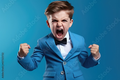 Anger Boy In A Blue Suit On Pastel Background . Сoncept Expressing Emotions Through Color, Calmly Responding To Anger, The Power Of Visual Representations, Determining The Effect Of Color On Mood