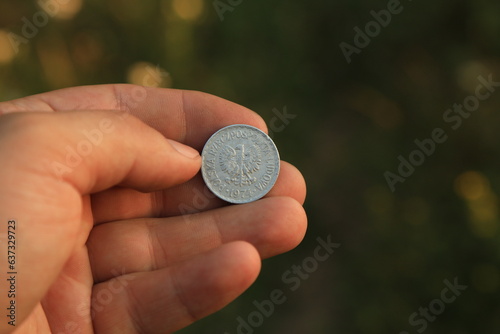 Old Polish coin in hand