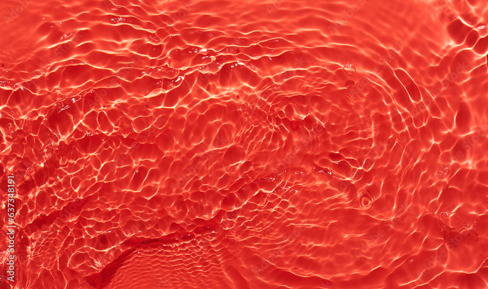 Water red surface abstract background. Waves and ripples texture of cosmetic aqua moisturizer with bubbles. Water red surface abstract background. Waves and ripples texture of cosmetic aqua moisturizer with bubbles.