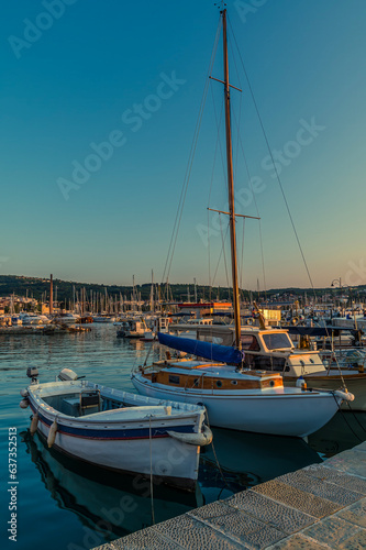 A view at sunset from the quayside in the harbour in the town of Izola, Slovenia in summertime © Nicola