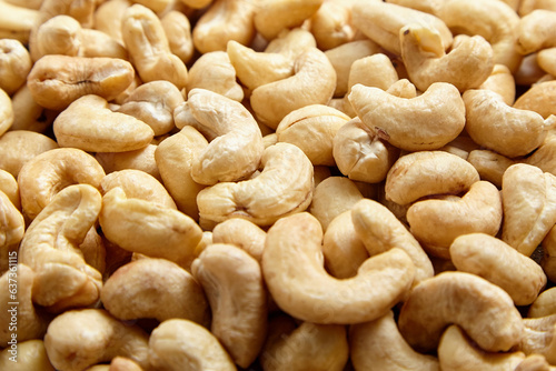 Cashew nut heap food texture background. cashews, ready to munch