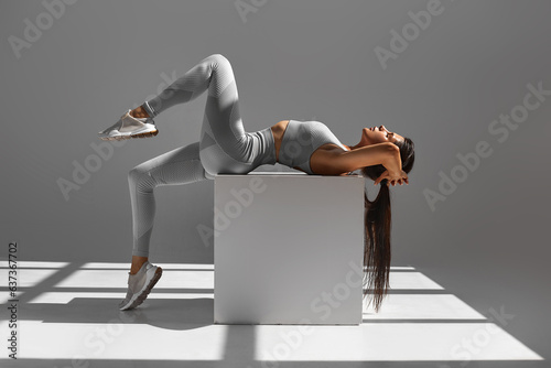 Athletic woman in sportswear doing stretching exercises in the gym. The concept of sports and recreation. healthy lifestyle