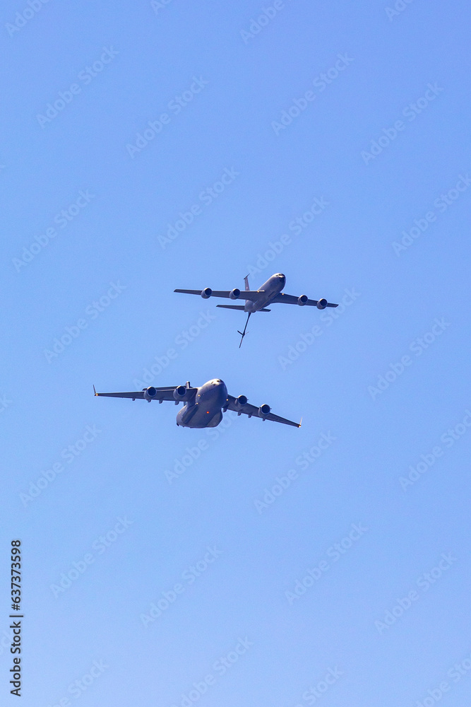 C-17 Globmaster and re-fueler in the sky for a demonstration at Pacific Airshow. Gold Coast, Australia C-17 Globmaster and re-fueler in the sky for a demonstration at Pacific Airshow. Gold Coast, Australia