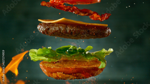 Beef Burger with Ingredients Falling and Landing in the Bun