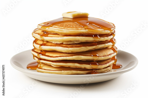 a stack of pancakes with syrup and butter on a plate