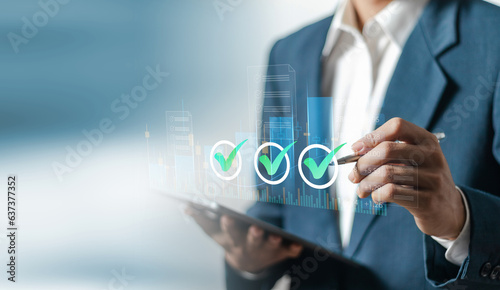 Project approval concept. Businessman analyzing business growth chart to approve corporate project.