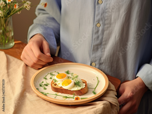 Person presenting beautiful eggs on toast breakfast, minimalist japanese aesthetic, eating breakfast at table
