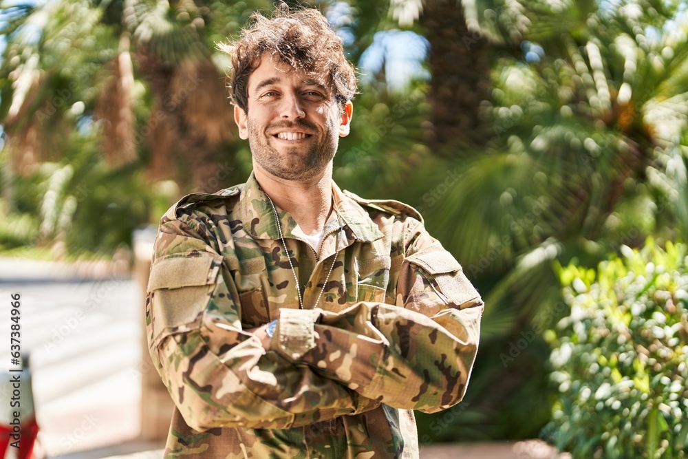 Young man army soldier smiling confident standing with arms crossed gesture at park