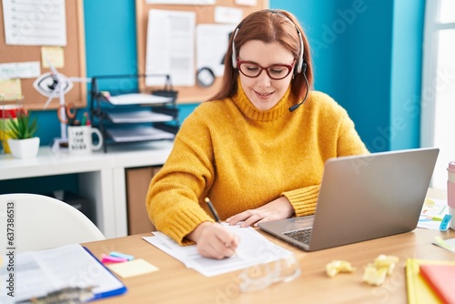 Young beautiful plus size woman call center agent smiling confident working at office