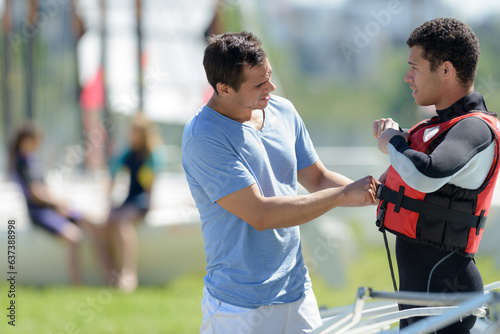 happy guy learning kitesurfing during vacation
