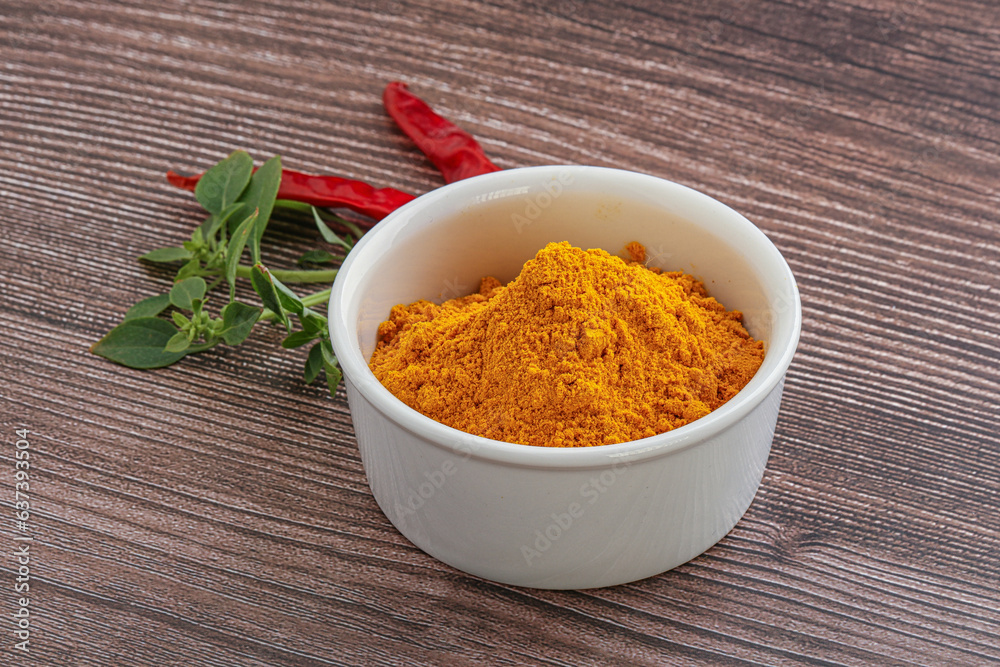 Yellow vibrant curcuma powder in the bowl Yellow vibrant curcuma powder in the bowl
