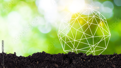 Earth Environment Day. Soil with Global network and connection with bokeh sunlight green nature background, ESG and Ecology CSR concept in the sustainability environmental, Save the world