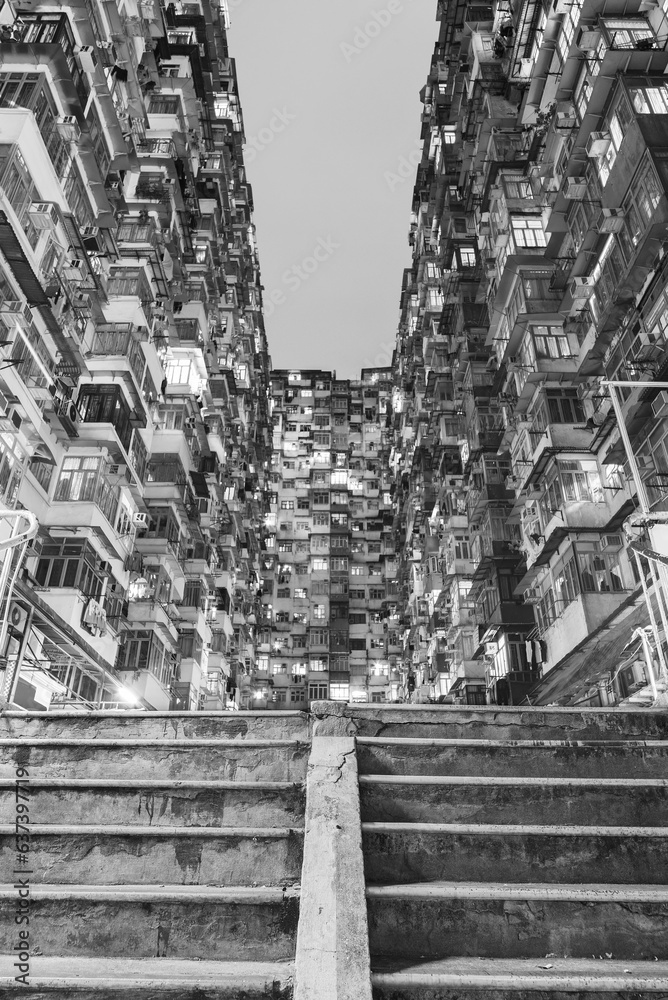 Old apartment building in Hong Kong city at night