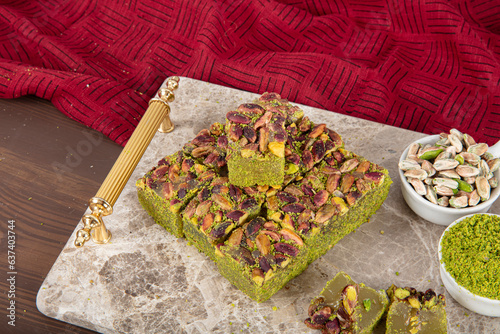 Delicious Turkish Delight with pistachios. Assortment of Turkish delight with pistachio. Mixed Turkish Delight. local name Antep fistikli lokum. photo