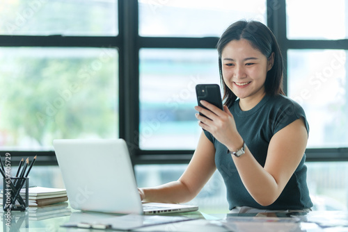 Beautiful businesswoman checking message on smartphone. Communication, connection, technology, business lifestyle concept. Free Download Beautiful businesswoman checking message on smartphone. Communication, connection, technology, business lifestyle concept. - GFXLoad