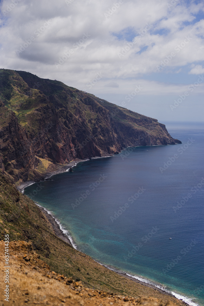 Travelling and exploring Madeira island landscapes and famous places. Summer tourism by Atlantic  ocean and mountains. Outdoor views on beautiful water, sky, cliffs, coastline and travel destination.