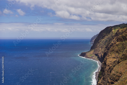 Travelling and exploring Madeira island landscapes and famous places. Summer tourism by Atlantic ocean and mountains. Outdoor views on beautiful water, sky, cliffs, coastline and travel destination.