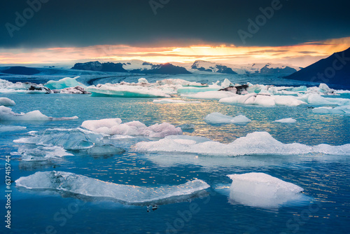 Sunset over natural iceberg in Jokulsarlon glacieer lagoon photo