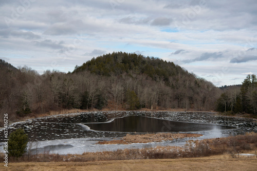 an icy pond in massachusetts wintertime