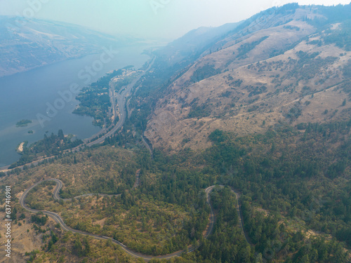 The Rowena Crest Viewpoint looks down on the scenic Columbia River Gorge separating Washington and Oregon. The area is a popular area for hiking, biking, fishing, and water sports. © ead72