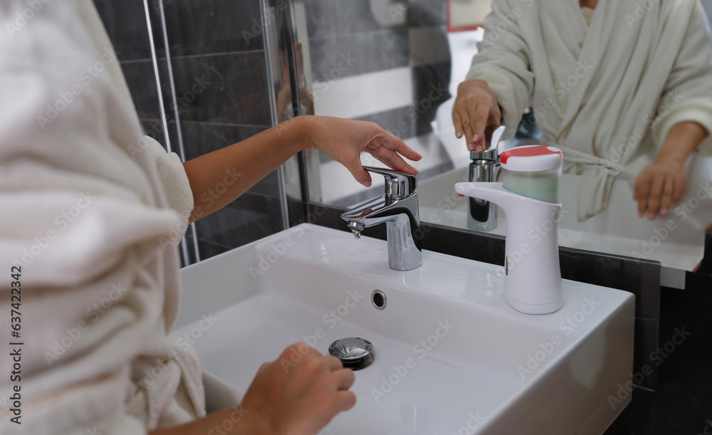 Woman hands from tap for washing hands. Personal hygiene and hand washing Woman hands from tap for washing hands. Personal hygiene and hand washing