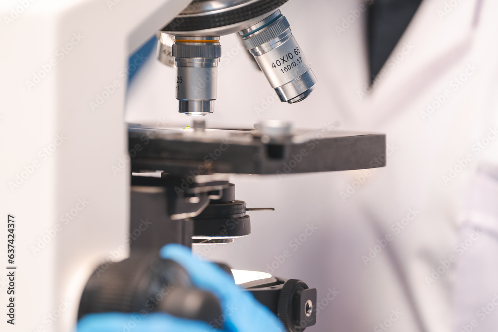 Closeup of Scientific microscope data analysis in the laboratory, medicine equipment setting in lab for chemistry or science research technology discovery, biotechnology or biology tool for study Closeup of Scientific microscope data analysis in the laboratory, medicine equipment setting in lab for chemistry or science research technology discovery, biotechnology or biology tool for study
