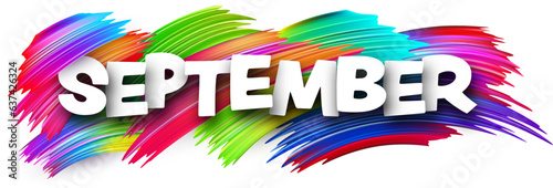 September paper word sign with colorful spectrum paint brush strokes over white. Vector illustration.