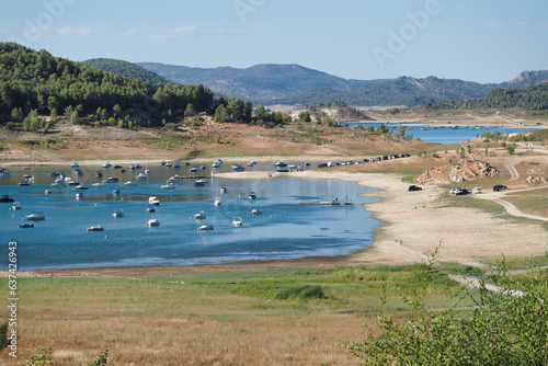 boats moored in the entrepeñas reservoir in sacedon photo