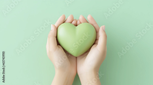 Obraz na płótnie Woman hands holding green heart, Happiness moment, Health care, Save world, donate and family insurance concept, World heart day, Health day, Hope, Gratitude, Kindness, Valentine's Day. Generative AI. w salonie