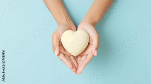 Woman hands holding yellow heart, Happiness moment, Health care, wellness, donate and family insurance concept, World heart day, Health day, Hope, Gratitude, Kindness, Valentine\'s Day. Generative AI.