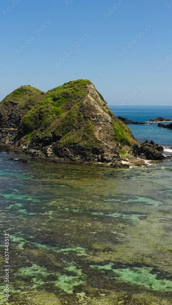 Aerial view of rocky islands and blue sea. Seascape in the Philippines. Aerial view of rocky islands and blue sea. Seascape in the Philippines.