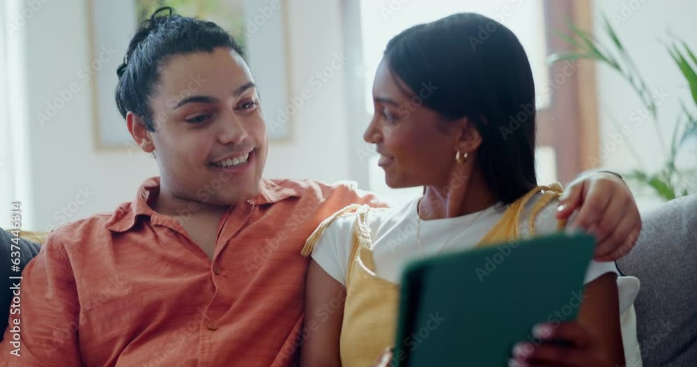 Couple, tablet and talking on sofa in living room for online shopping, streaming or funny movies. Happy man, woman or scroll on social media news, subscription or laugh for meme on digital technology Couple, tablet and talking on sofa in living room for online shopping, streaming or funny movies. Happy man, woman or scroll on social media news, subscription or laugh for meme on digital technology