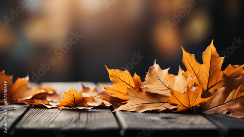 Autumn leaves on wooden table in cafe. Autumn background with copy space