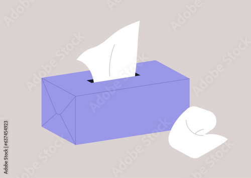A cardboard container holding single-use paper tissues
