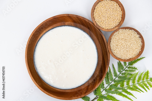 Selective focused image of fermented batter for idli and dosa in an isolated background. Idly and dosa batter in a bowl for fermentation, used to prepare the dosa and idli.. photo