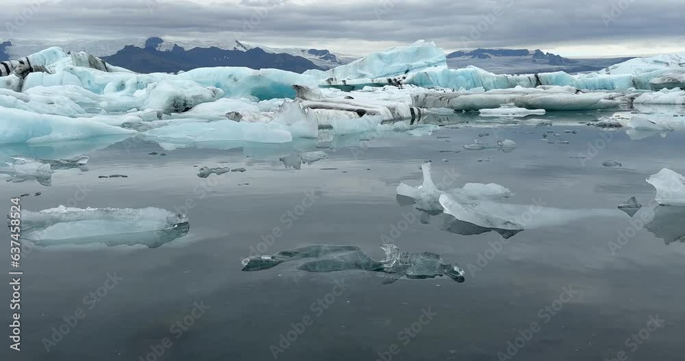 Jokulsarlon glacial lagoon lake in Iceland, chunks of blue icebergs, cold landscape in Europe Jokulsarlon glacial lagoon lake in Iceland, chunks of blue icebergs, cold landscape in Europe