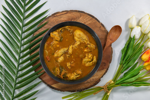 Obraz na płótnie Chicken curry or masala or country chicken kuzhambu Tamilnadu style , chicken curry using fried coconut oil in traditional way and decorated in white bowl. Main dish for rice, chapati and paratha... w salonie