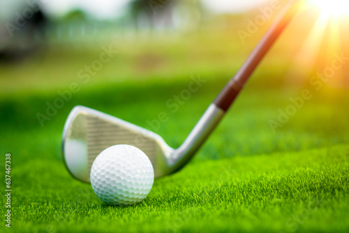 Golf ball close up on tee grass on blurred beautiful landscape of golf background. Concept international sport that rely on precision skills for health relaxation.