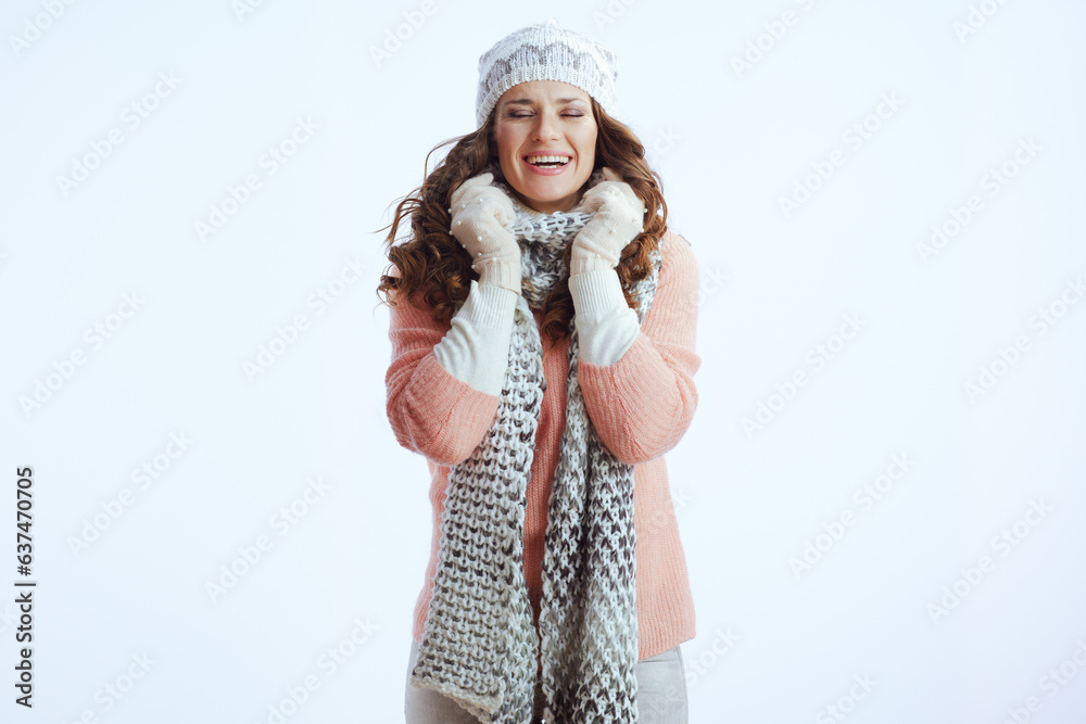 smiling trendy female in sweater, mittens, hat and scarf smiling trendy female in sweater, mittens, hat and scarf