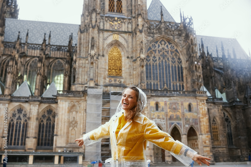 smiling trendy woman in Prague Czech Republic sightseeing