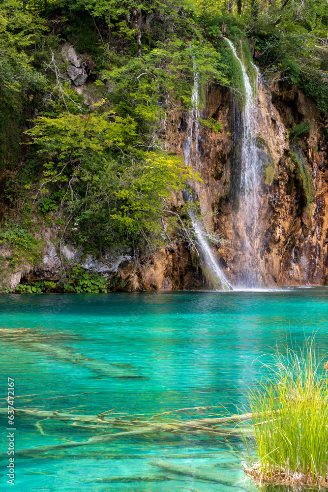 Small waterfall with azure water in Plitvice Park, Croatia.