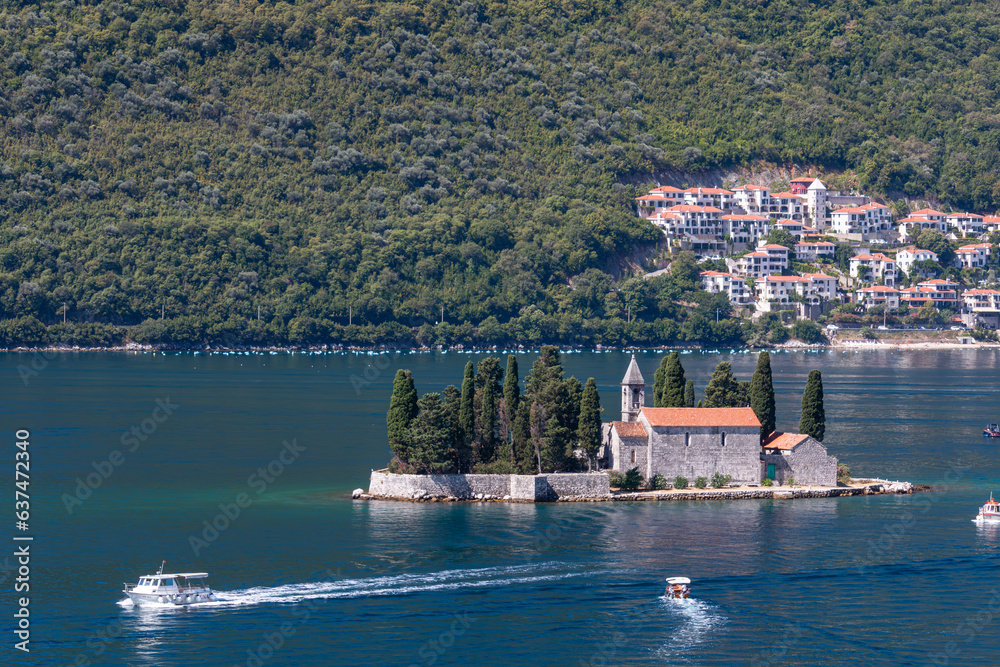 Side view of St.George Island in Montenegro with a boat nearby