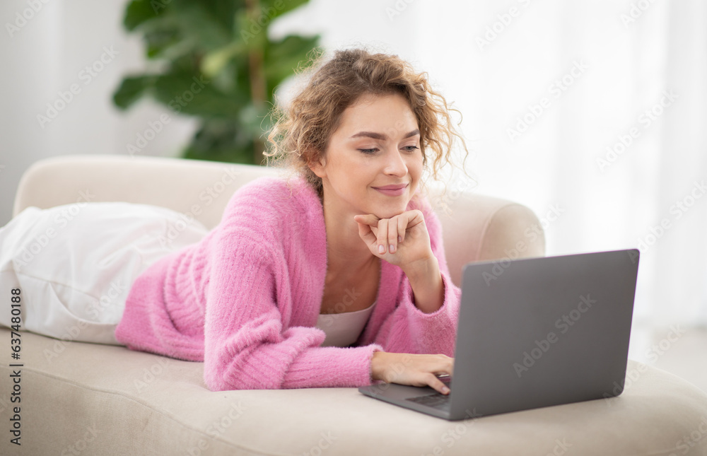 Beautiful Young Woman Relaxing On Couch With Laptop Computer Beautiful Young Woman Relaxing On Couch With Laptop Computer
