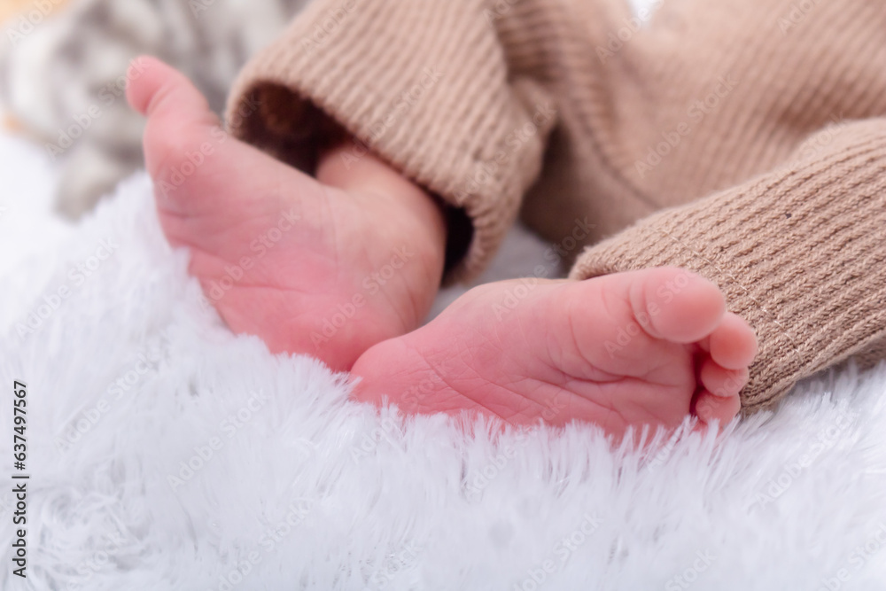 Foot of newborn baby. Close up of Hispanic newborn baby girl's feet Foot of newborn baby. Close up of Hispanic newborn baby girl's feet