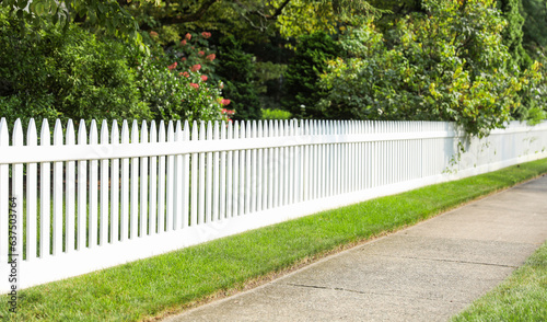 pristine white fence symbolizing purity, protection, and boundaries, evoking a sense of charm and suburban idyll