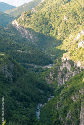 Beautiful view with a river in between two mountains.