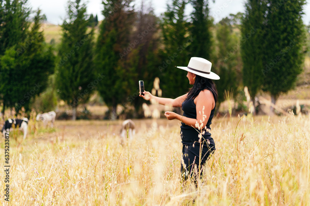 millennial in the field taking a selfie millennial in the field taking a selfie